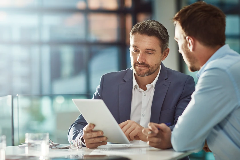 Two professionals discussing property information